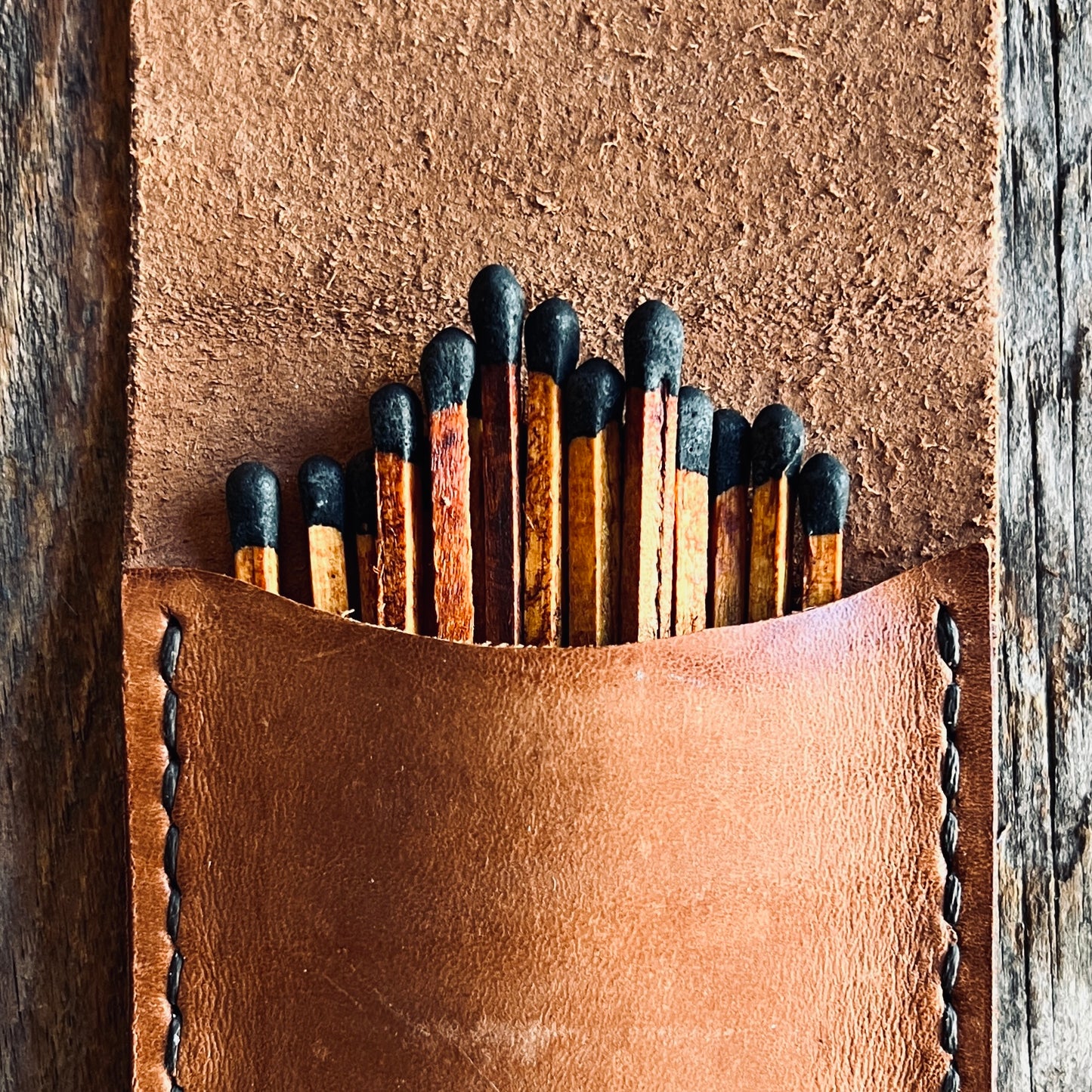 Espresso Stained Matches resting in a Sondera 1974 Leather Matchstick carrying case