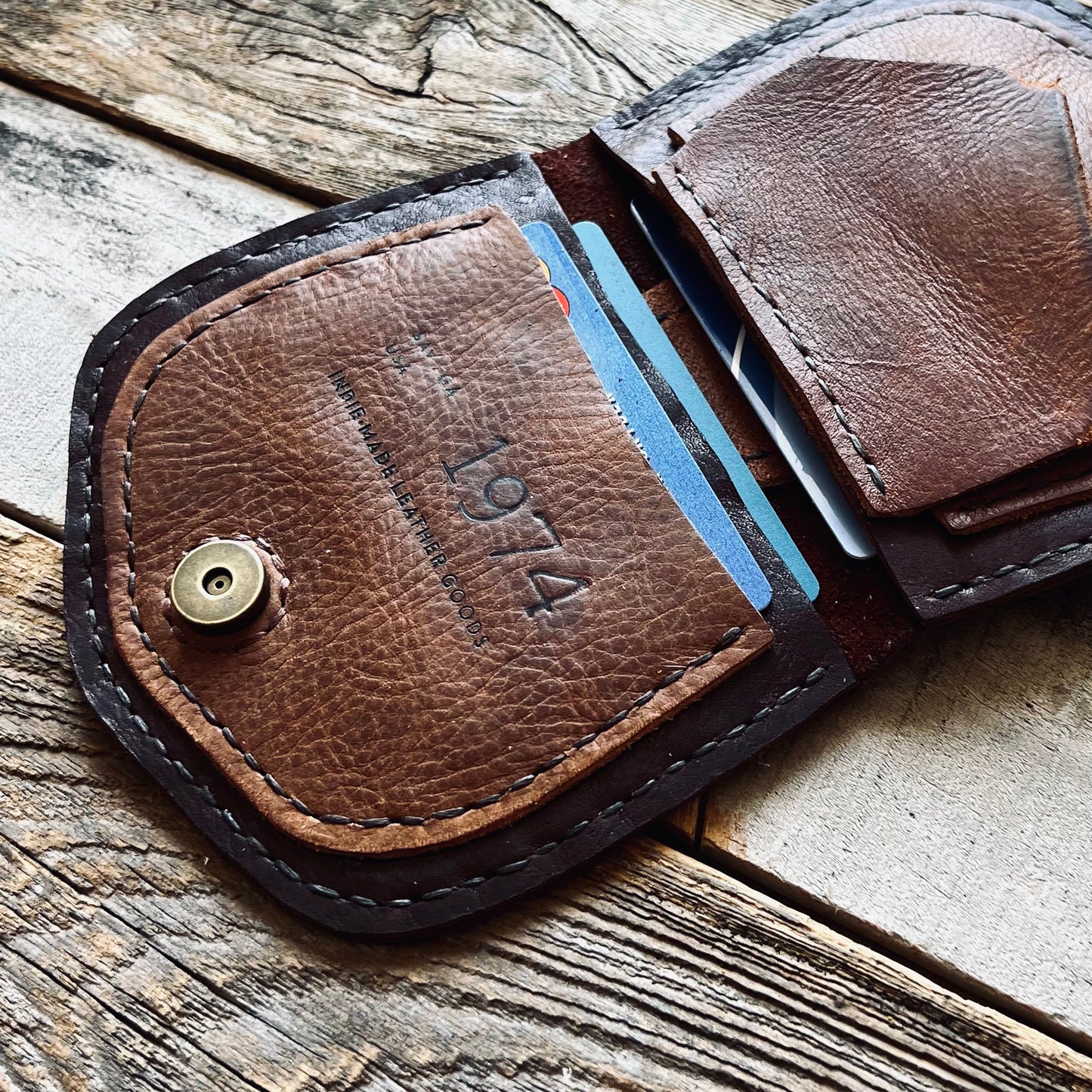 1974 Thames River Wallet in Chestnut & Hickory showing the 1974 embossed brand logo on the inside pocket