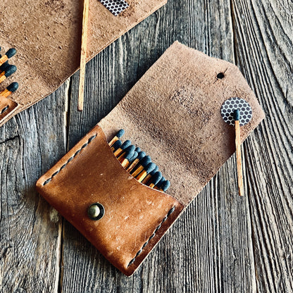 Shorty Leather Matchstick Case made by Sondera 1974 and featured on a wooden background
