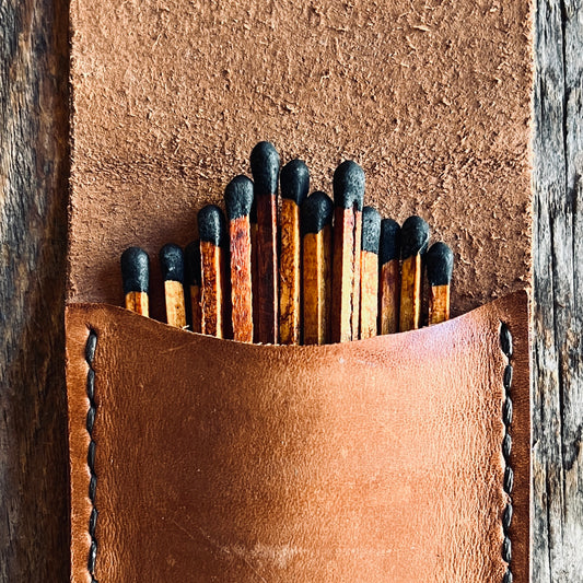 Espresso Stained Matches resting in a Sondera 1974 Leather Matchstick carrying case