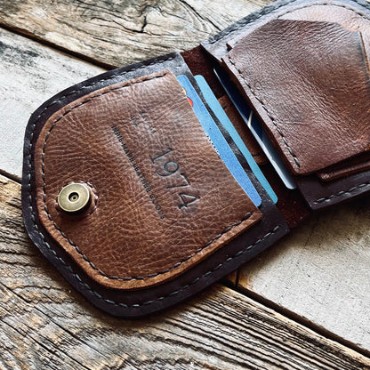 1974 Thames River Wallet in Chestnut & Hickory showing the 1974 embossed brand logo on the inside pocket